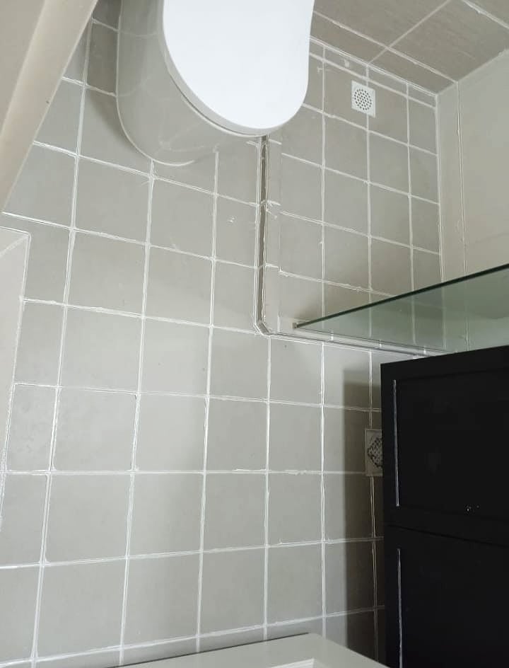 Bathroom tile floor with refreshed grout lines
