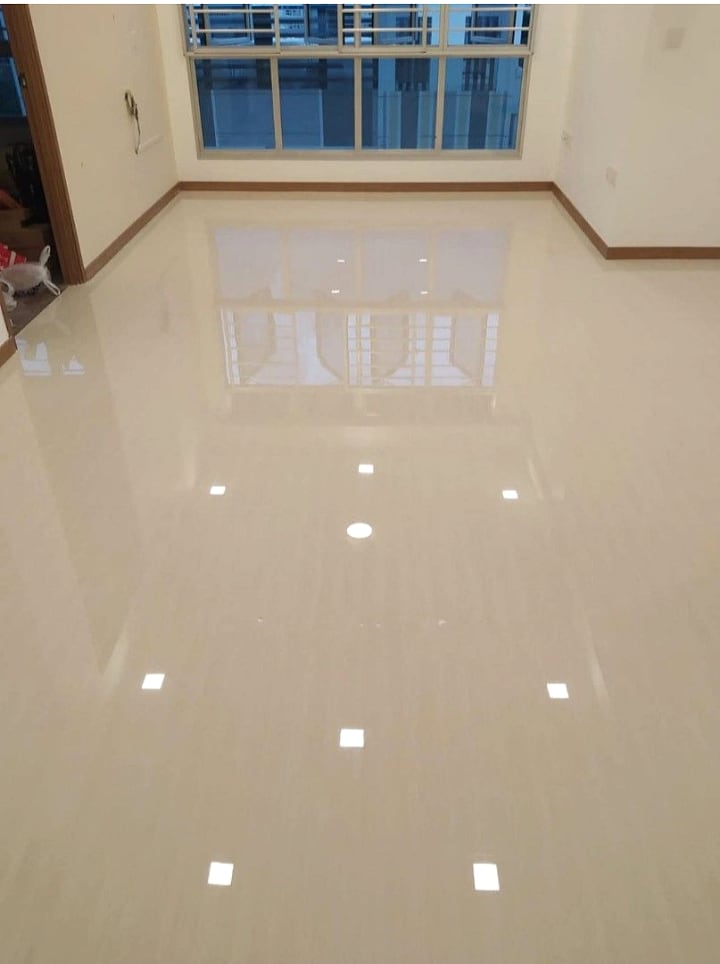 Finished epoxy grouting floor with clean reflective tile surface
