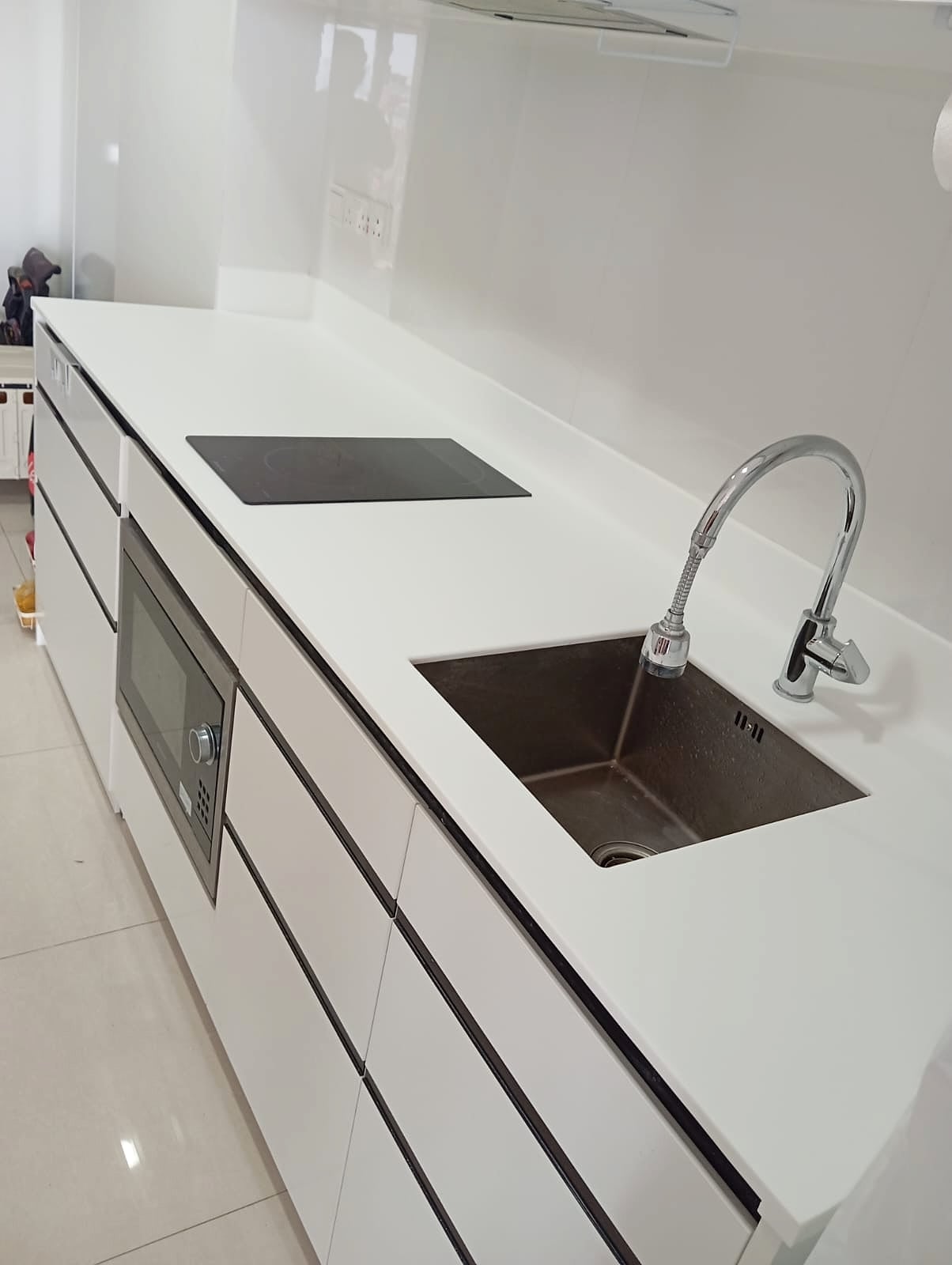 Completed kitchen countertop polish with sink and hob area