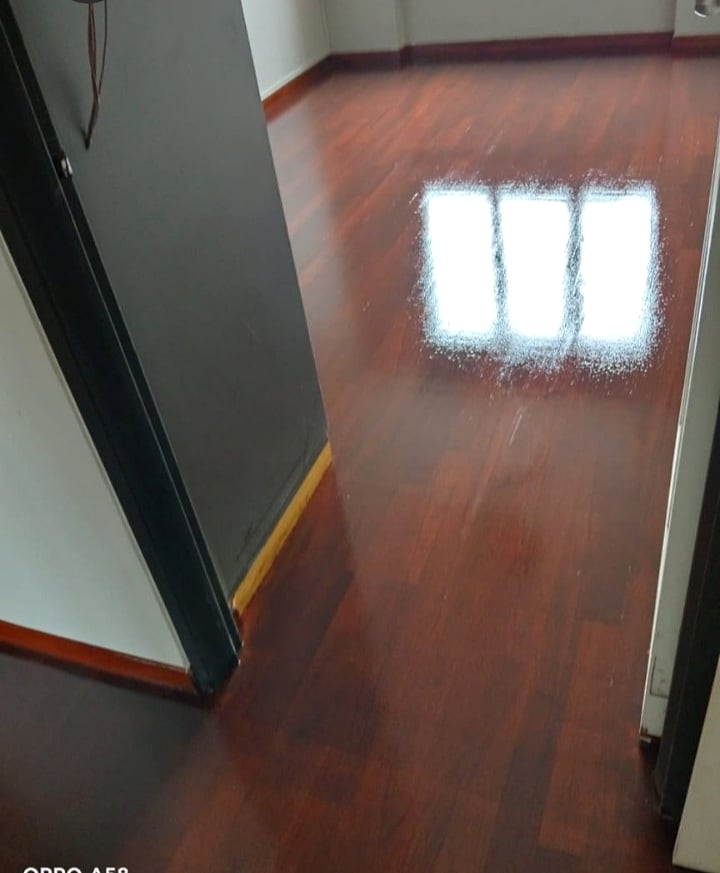 Dark wood parquet floor with restored polished shine