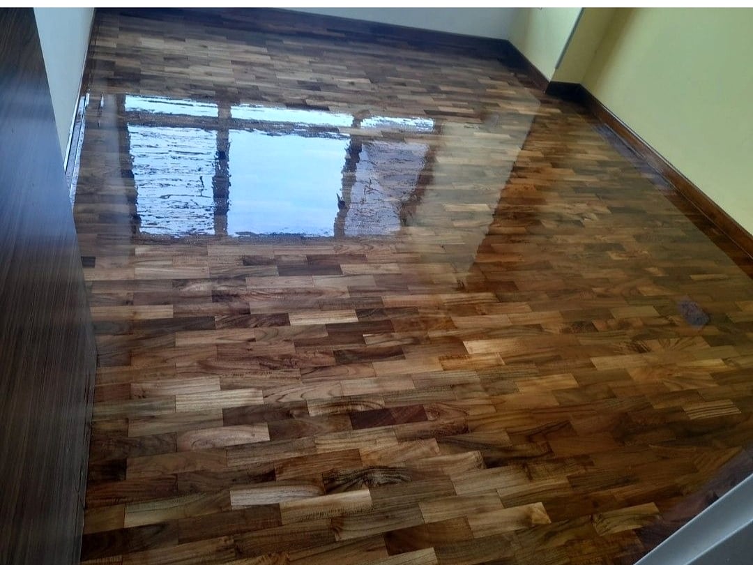 Finished bedroom parquet floor with skirting around the room edge