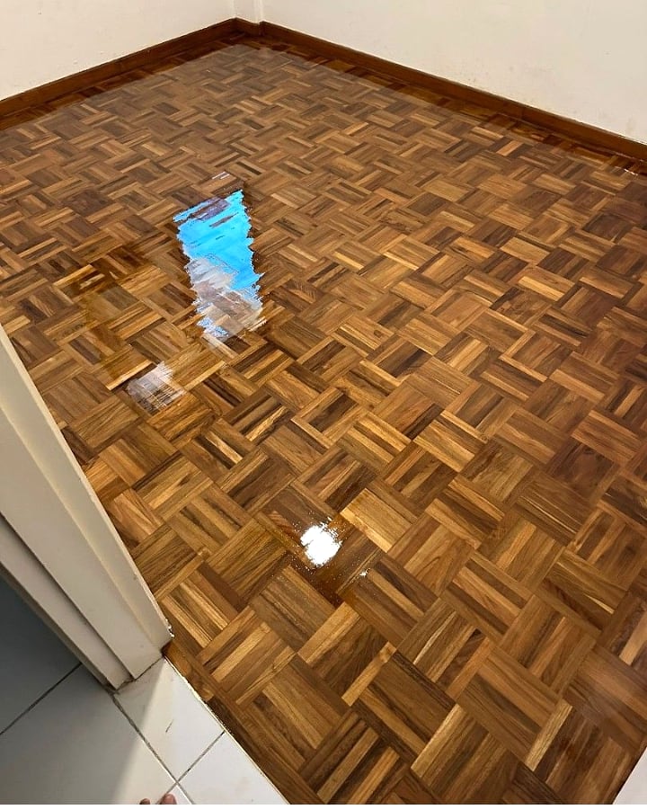 Glossy parquet floor after polishing and varnishing