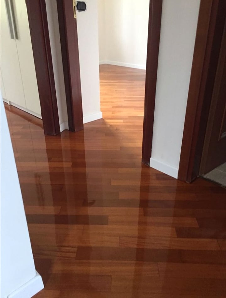 Glossy wood corridor floor with clean skirting lines