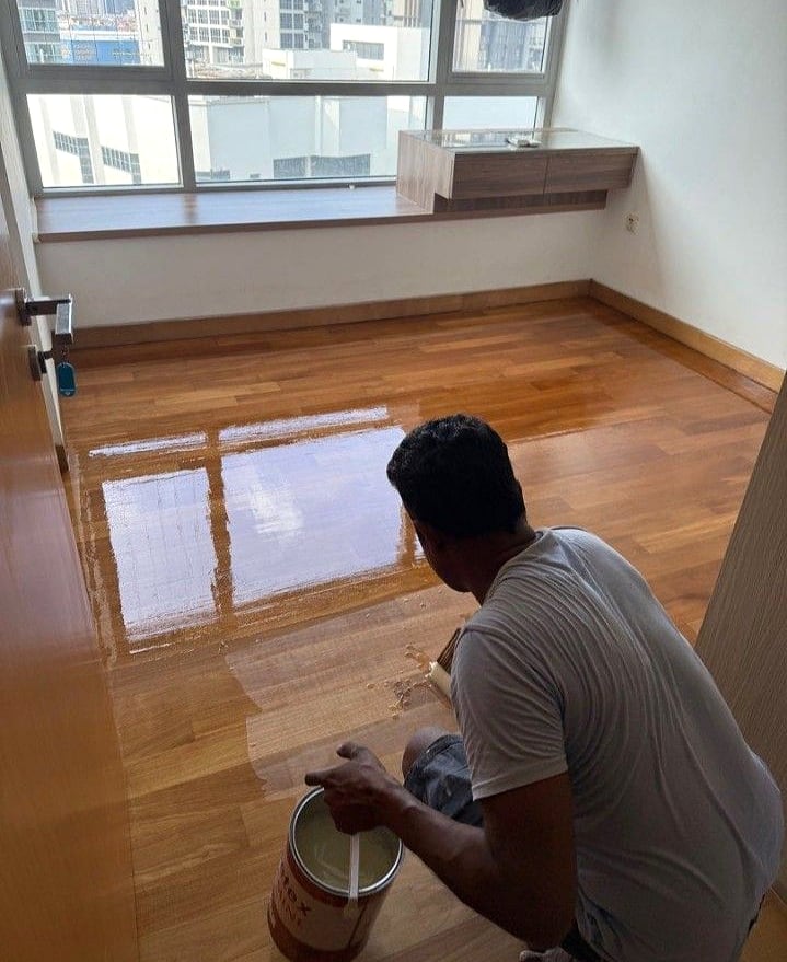 New varnish being applied to a timber floor