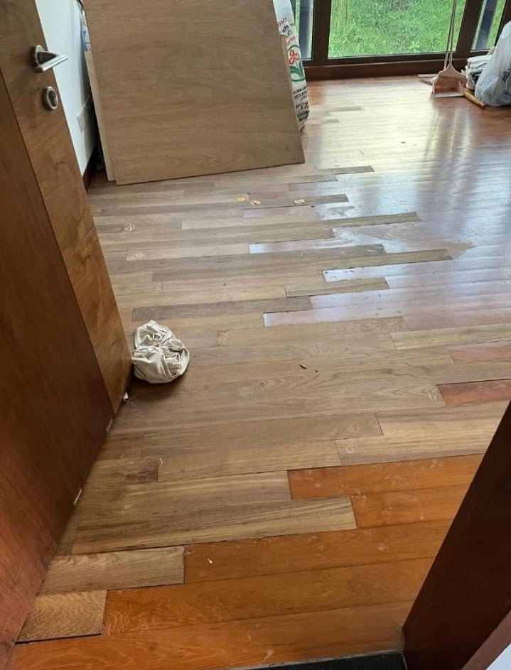 Parquet boards being installed across a residential floor