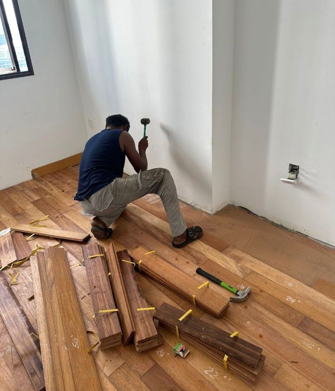 Parquet flooring installation layout with timber planks prepared on site