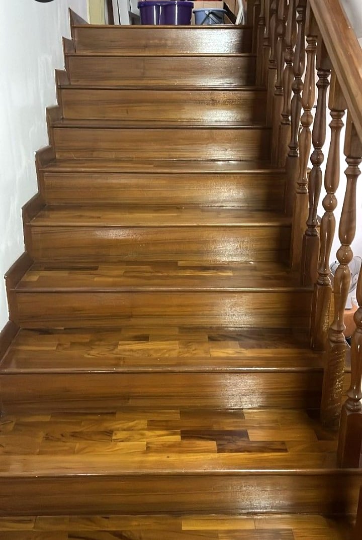 Varnished timber staircase with a restored glossy finish