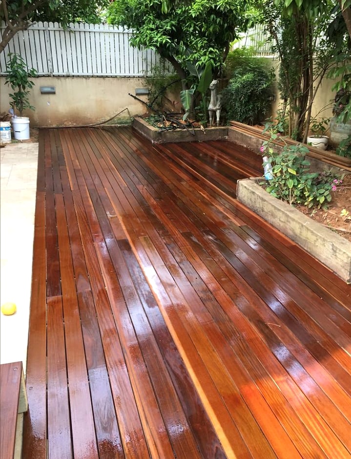 Garden wood deck with a fresh protective coating