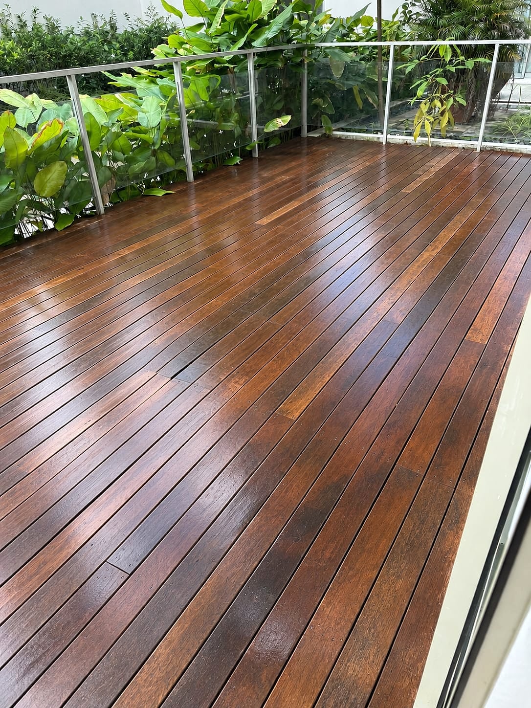 Restored balcony wood deck with warm finished boards