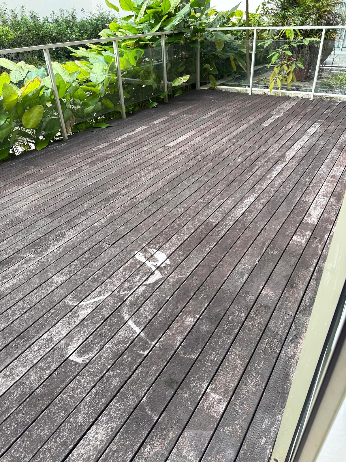 Weathered wood deck before installation and repair work
